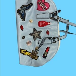 Stylish Blue Handbag with Fun Patches